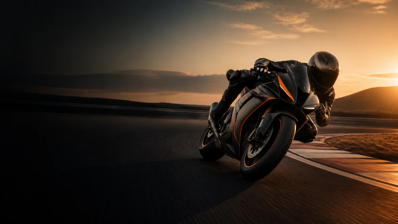 Sport motorcycle leaning through a racetrack corner at sunset